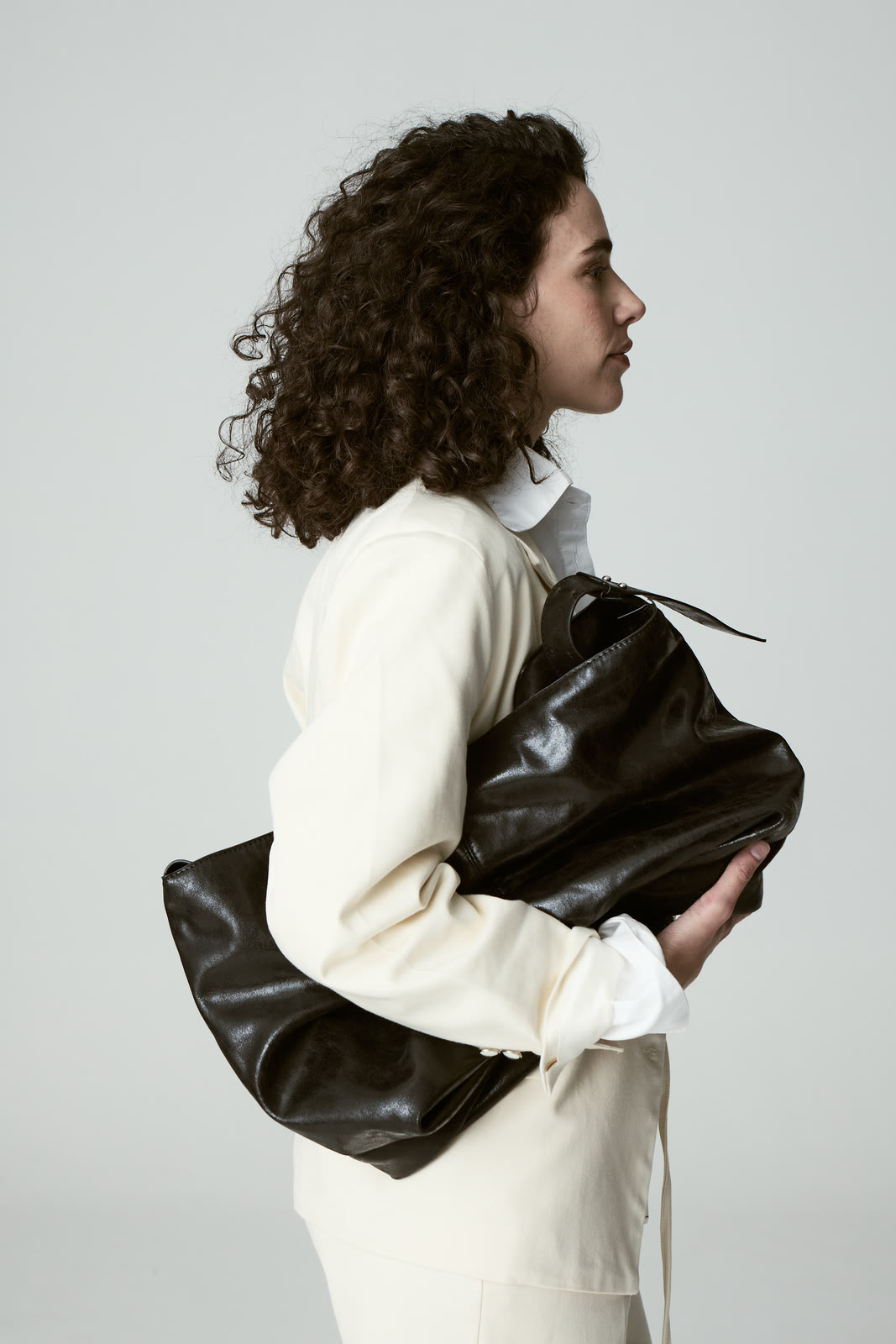A close editorial studio portrait