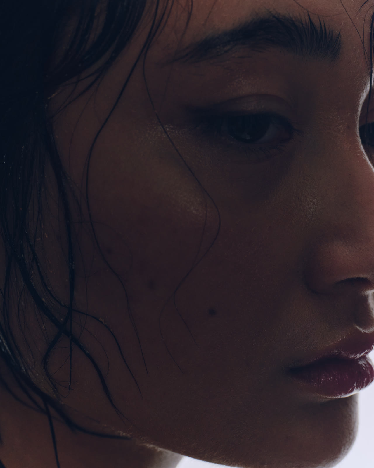 A close, contemplative studio portrait